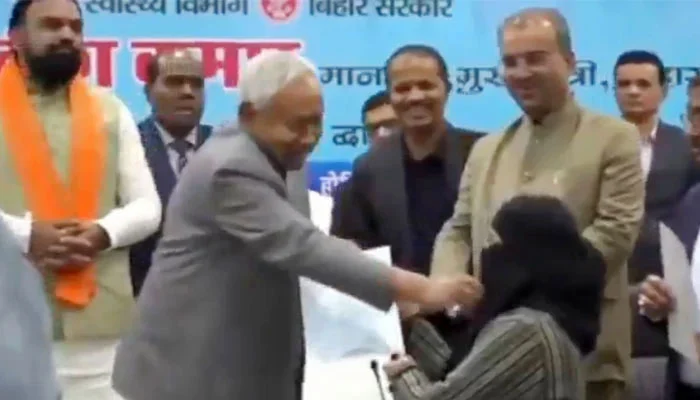 Bihar chief minister draws outrage for forcibly lifting Muslim doctor’s niqab on stage