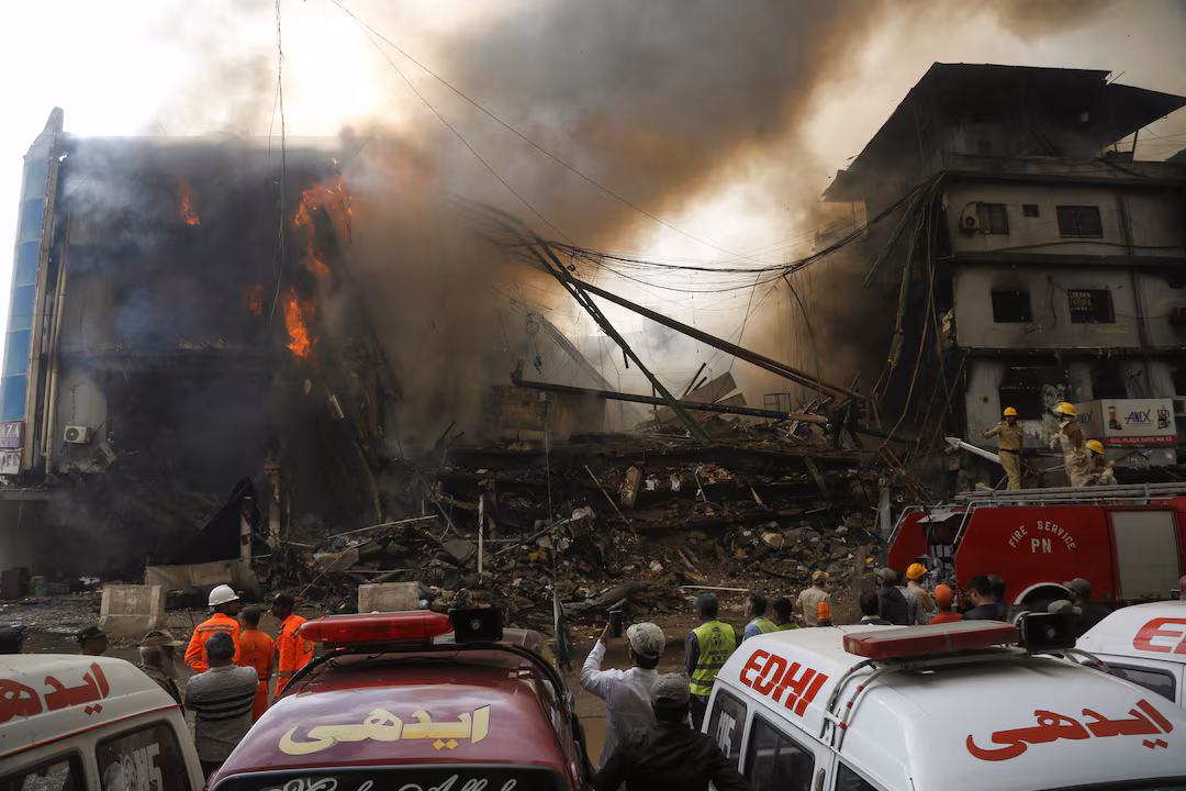 Six dead, dozens feared trapped as rescuers battle a raging fire at Karachi’s Gul Plaza